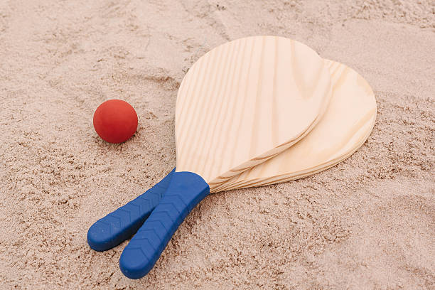 Beach tennis, beach paddle ball, matkot. Beach rackets and ball Beach tennis, beach paddle ball, matkot. Beach rackets and ball on the beach sand paddle ball stock pictures, royalty-free photos & images