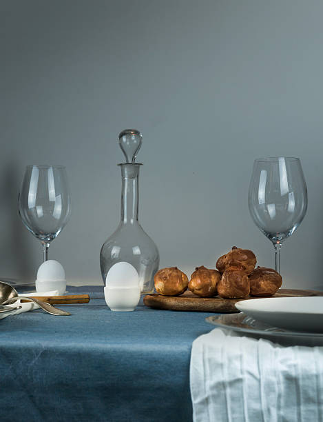 istock still life. rustic dinner. old damask, glasses, buns on the 615385348