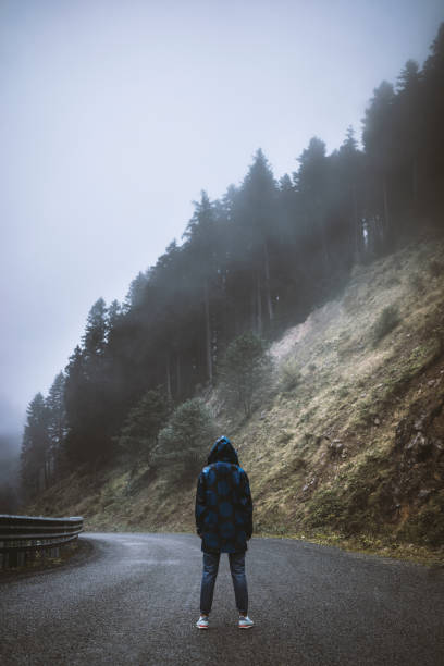 istock Traveler on the mountain road 615386076