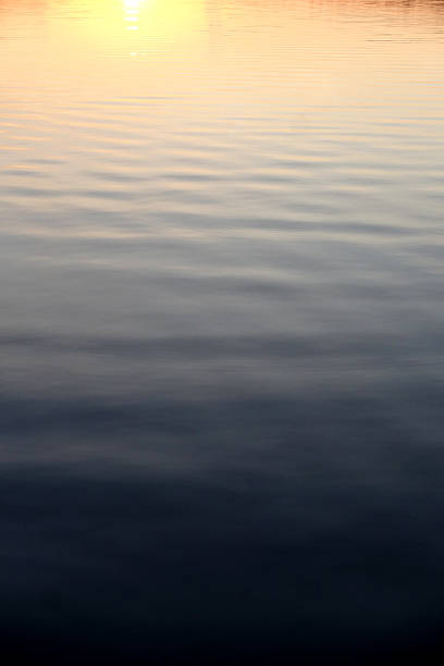 istock Sunset reflecting off of the Water 615386152