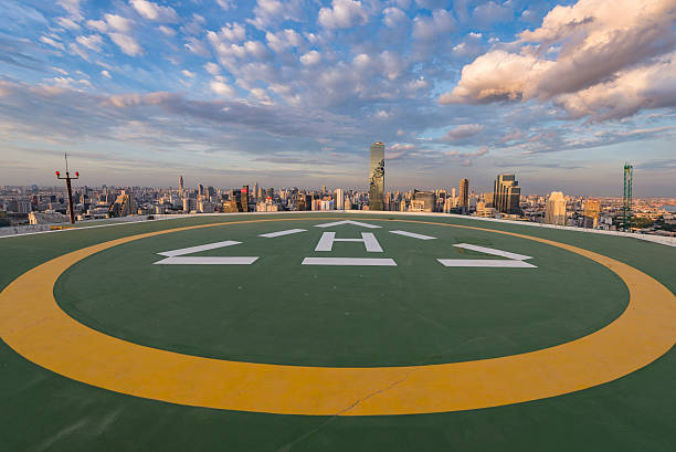 Parking helicopter on rooftop in the city stock photo