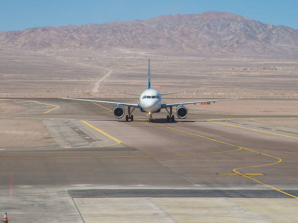 istock Aircraft taxiing to terminal 615386542