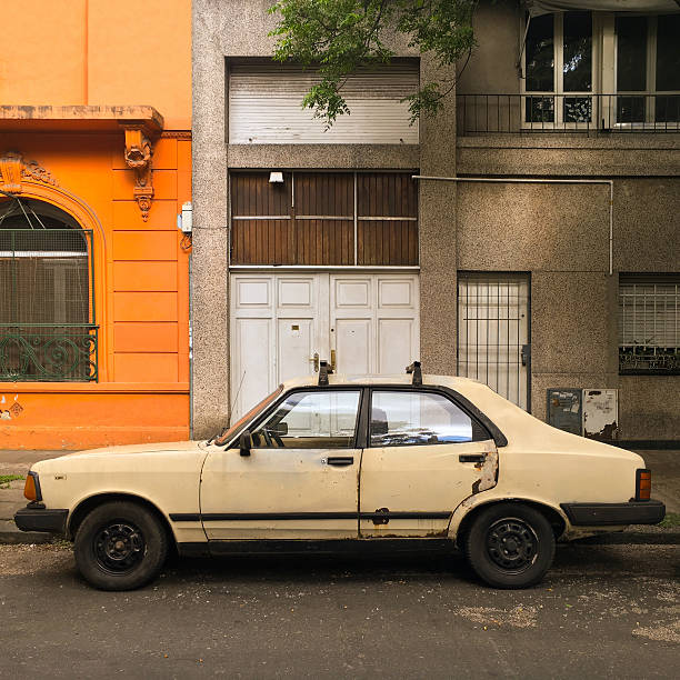 istock Old car parked in the street 615387894