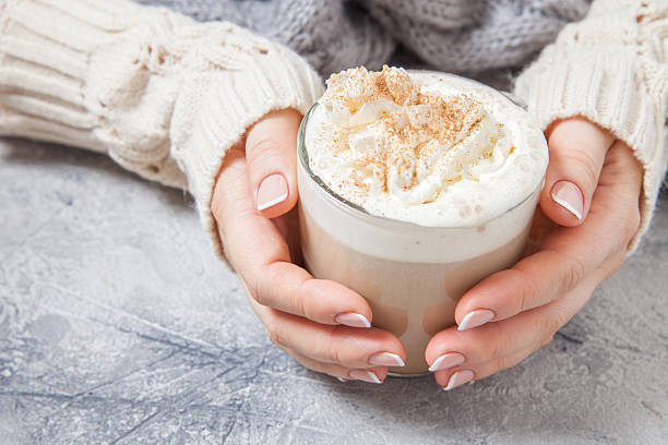 istock woman hands with a latte 615392770