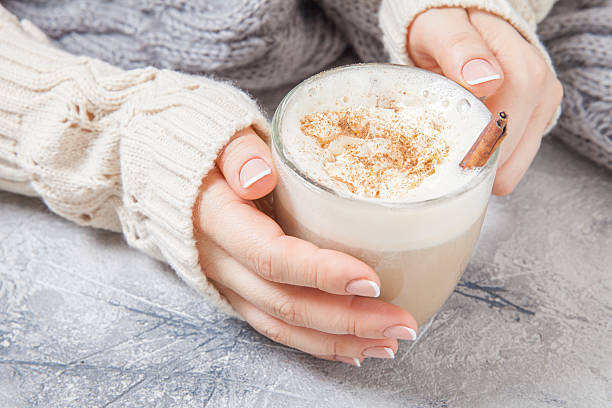 istock woman hands with a latte 615392880