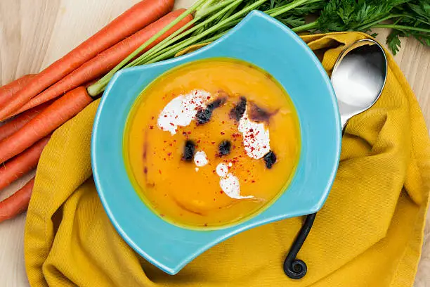 Thai carrot soup with ginger and spices. Thanksgiving menu. Vegan menu. Vegetable soup.