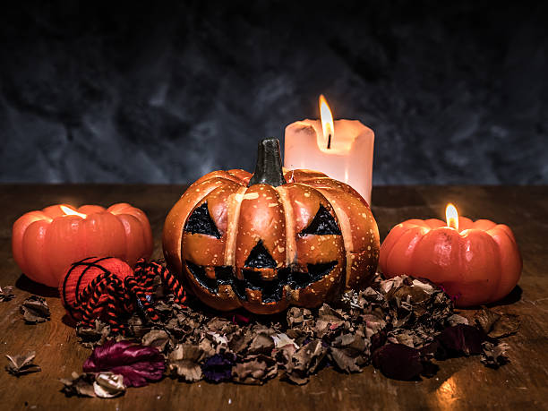 istock Halloween pumpkins with candlelight on dark background. 615393466