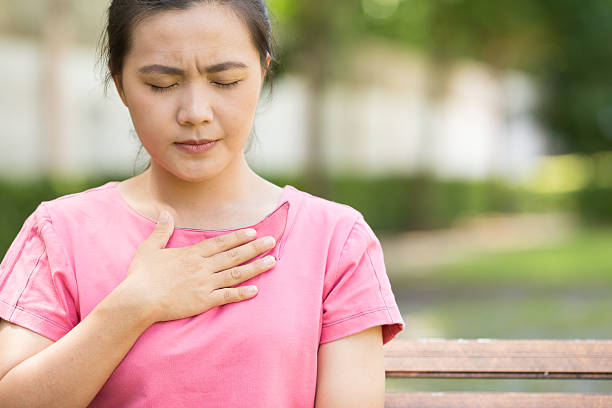 istock Woman has reflux acids in the garden 615395050