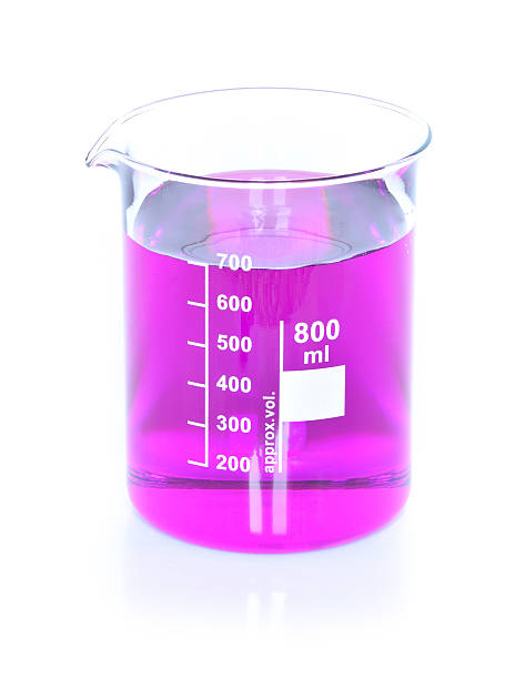 istock Chemical beaker with permanganate dissolved in water 615395438