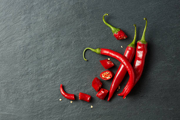 istock Chilean red pepper slices and seeds 615395920