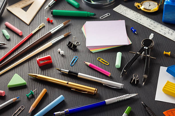 istock school supplies on black wood 615398178