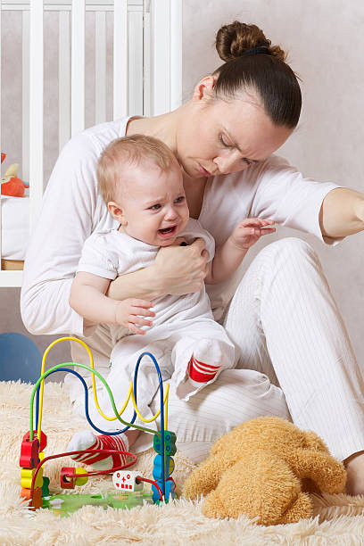 istock Young mother is making quiet the daughter 615398650