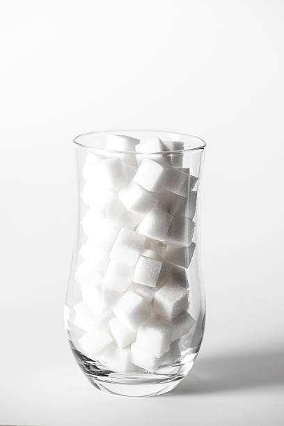 istock Sugar Cubes in Glass 615399170
