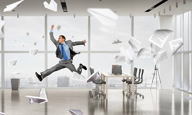 istock Dancing businessman in office room . Mixed media 615399330
