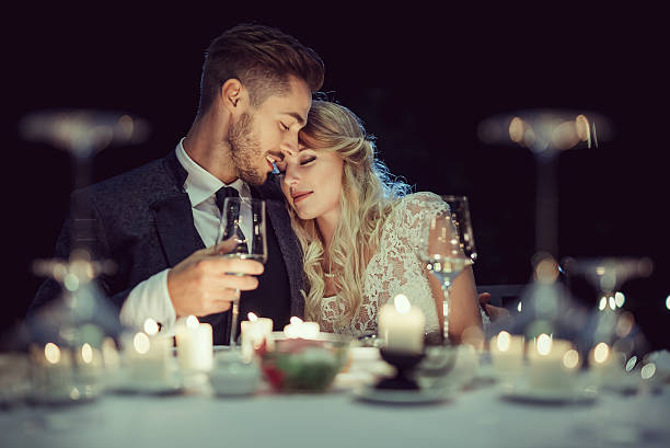 Wedding Just married beautiful couple has a romantic dinner candlelight photos stock pictures, royalty-free photos & images