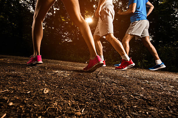 istock Group of unrecognizable athletes starting a race in nature. 615401754