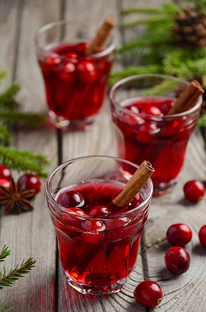 istock Cranberry drink on wooden background 615401900