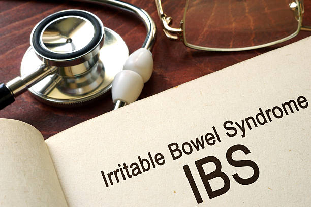 istock Book with words irritable bowel syndrome IBS on a table. 615402158