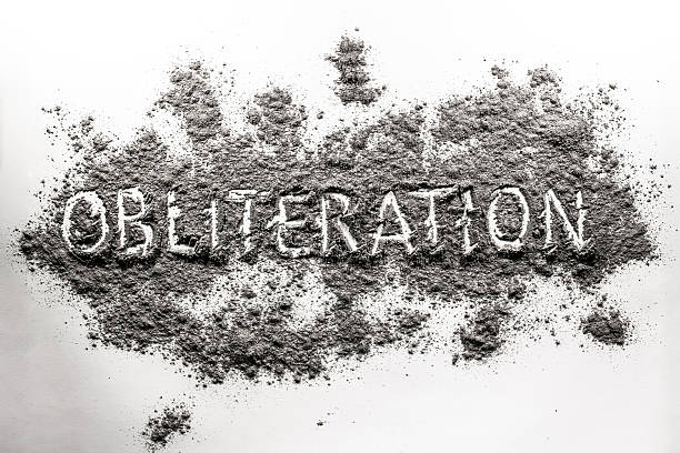 istock Word obliteration written in an ash, dust, dirt, war concept 615402624