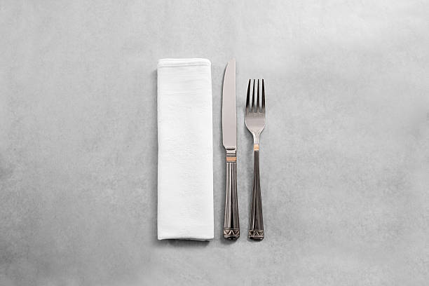 istock Blank white restaurant napkin mock up with fork and knife, 615405088