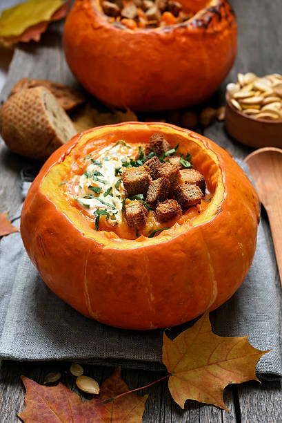istock Cream soup in pumpkin 615405380