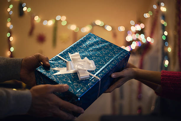 istock Hand holding box for a Christmas gift. Happy New Year. 615408056
