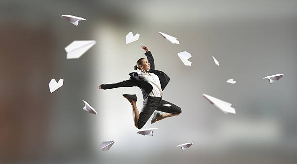 istock Dancing businesswoman in office . Mixed media 615408312