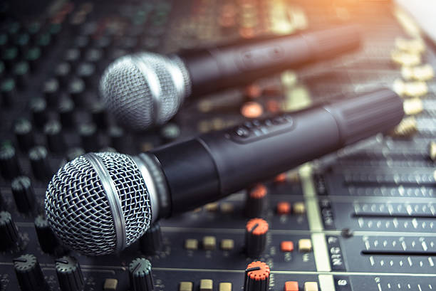 istock microphone on sound mixer out of focus background 615408546