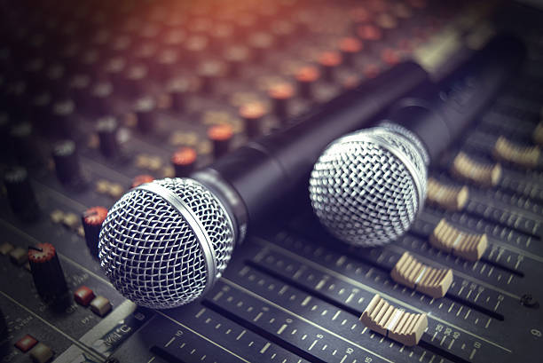 istock microphone on sound mixer out of focus background 615408590
