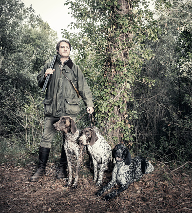 Hunter with purebreed hunting dogs