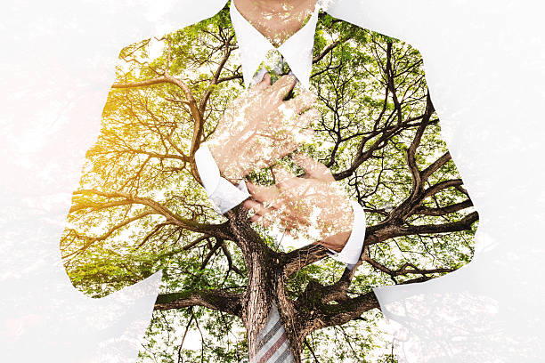 istock Double Exposure Businessman in Suit with Big Tree 615410204