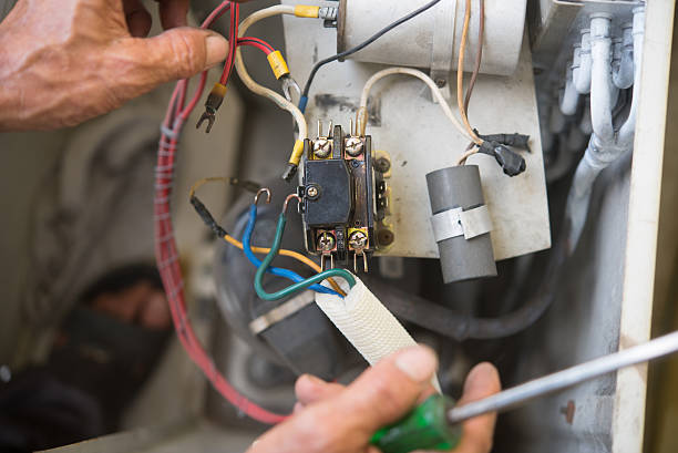 istock Air Conditioning Technician install new air conditioner. 615411816