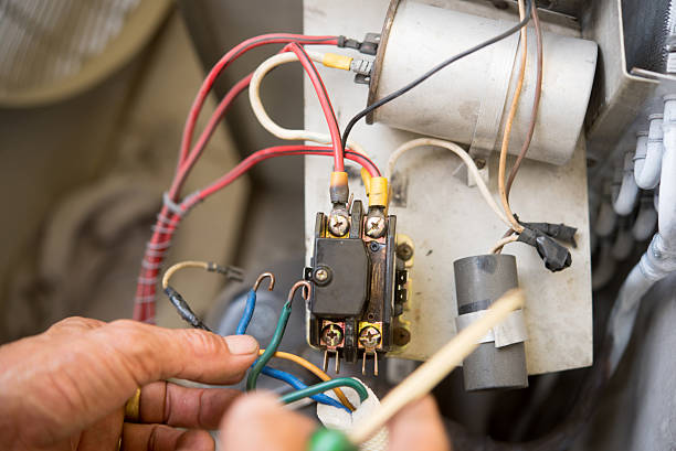 istock Air Conditioning Technician install new air conditioner. 615412246