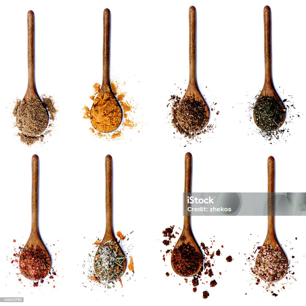 Collection of Spices in Wooden Spoons Collection of Various Spices in Wooden Spoons Spice Stock Photo