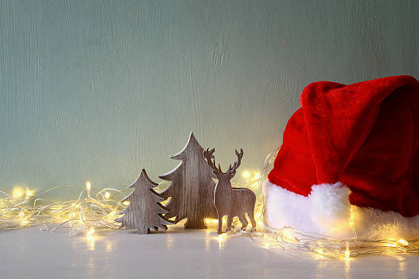 istock Low key of wooden christmas tree and deer 615413082