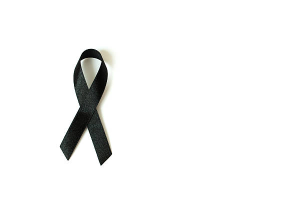 istock Black awareness ribbon on white background. Mourning and melanom 615414184