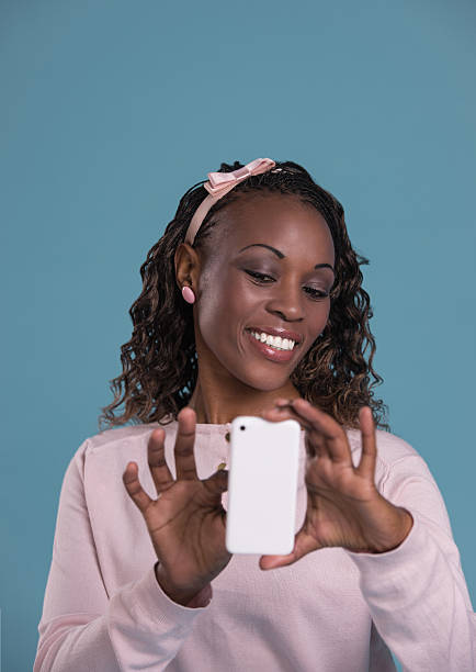 istock Pretty woman smartphone 615415566
