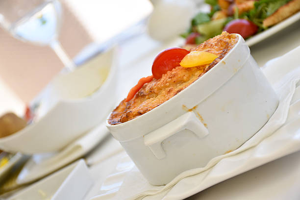 Mediterranean dish baked with crust on top, served in a white porcelain dish