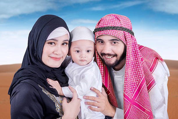 istock Arabic parents and their child at desert 615416602
