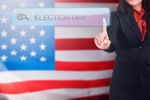 Business woman written a Election Day in search bar on virtual screen