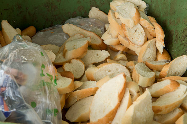 Bread In Garbage Can stock photo