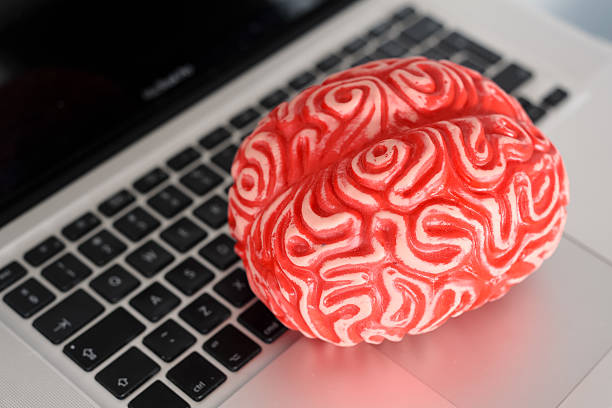 istock fake brain on the laptop 615418506