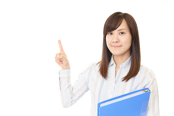 istock Young business woman pointing 615418918