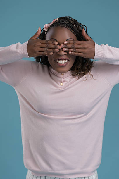 istock African woman hiding eyes 615419786