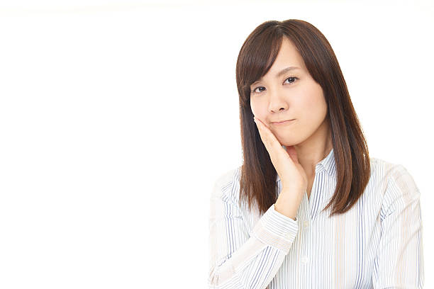 istock Uneasy Asian woman 615420548