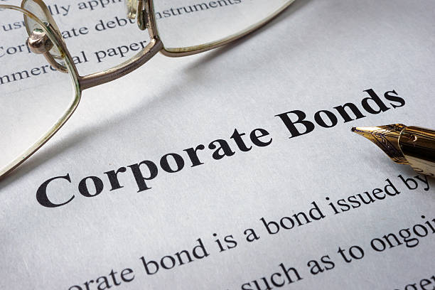 istock Page of newspaper with words corporate bonds. 615421294