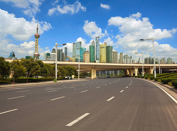 istock Empty road surface with shanghai bund city buildings 615421682