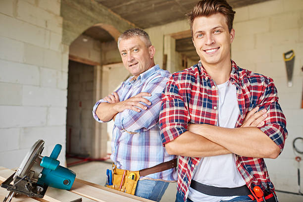 istock Two of carpenters posing to the camera 615421926