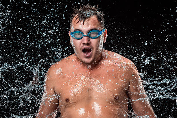 istock The water splash on male face 615424928