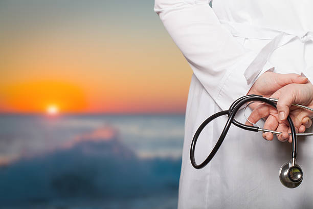 istock The doctor put his hands with stethoscope behind his back 615425414